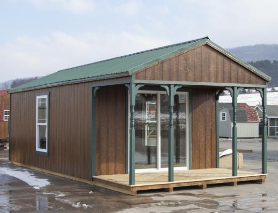 12x28 White Deer Cabin with front porch and patio doors at Pine Creek Structures of Spring Glen, PA